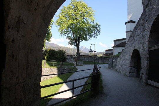 Ancient stone archway leading into the Kufstein Fortress grounds in Tyrol, Austria.