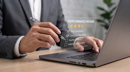 Fototapeta premium Close-up of manager hand checking goals on virtual performance review checklist displayed over laptop keyboard, human resources evaluation and employee assessment concept