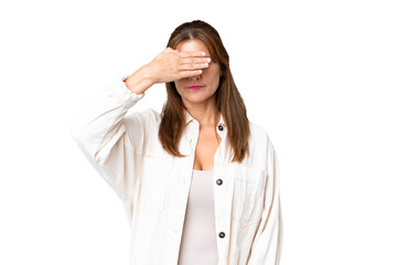 Obraz premium Middle age woman over isolated background covering eyes by hands. Do not want to see something