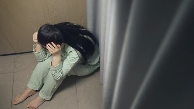Stressful depressed woman sits floor, mental breakdown crying sadly covering face with hands, domestic violence against women with health illness, headache, migraine, emotional anxiety, panic disorder