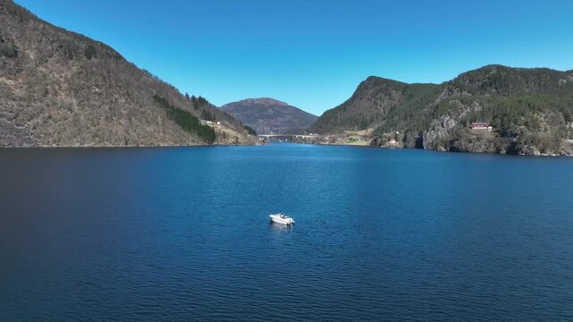 Boat alone near Kallestadsundet at Veafjorden in Vaksdal Norway on sunny spring day