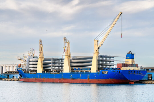 Chinese heavy lift cargo vessel unloading wind turbine blades while docked at Port Adelaide, South Australia. 