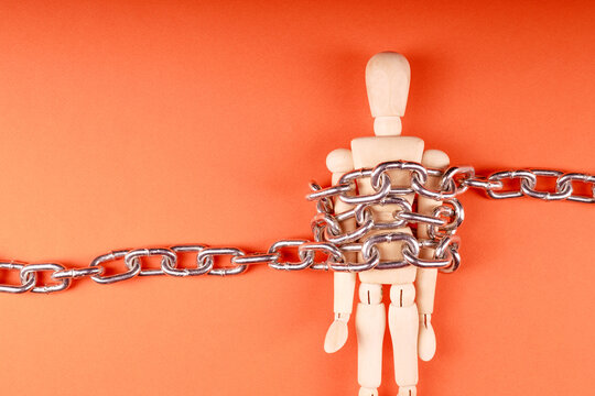 capturing the personality in a photo of a mannequin that is chained in a shiny chain