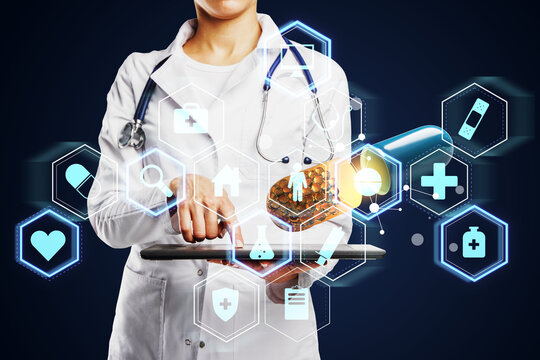 Doctor using digital medical interface with pill imagery and health icons on dark background illustrating modern healthcare technology concept.