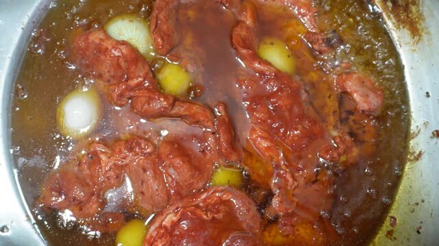 Marinated Meat Cooking with White Onions at a Mexican Street Food Stall