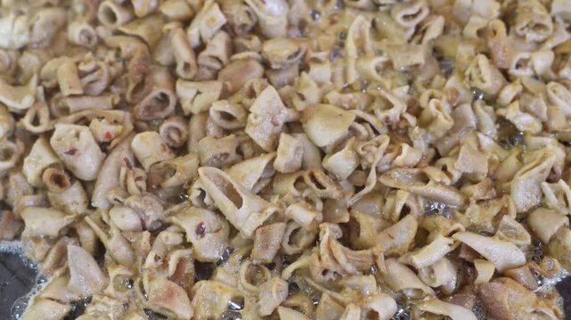 Street Food Vendor Preparing Crispy Tripas for Tacos