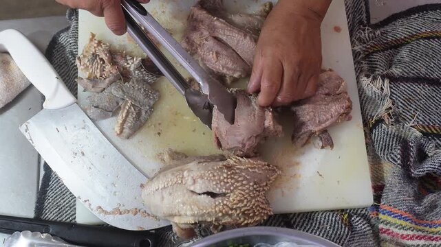 Hands Preparing Beef Cheek for Authentic Mexican Tacos