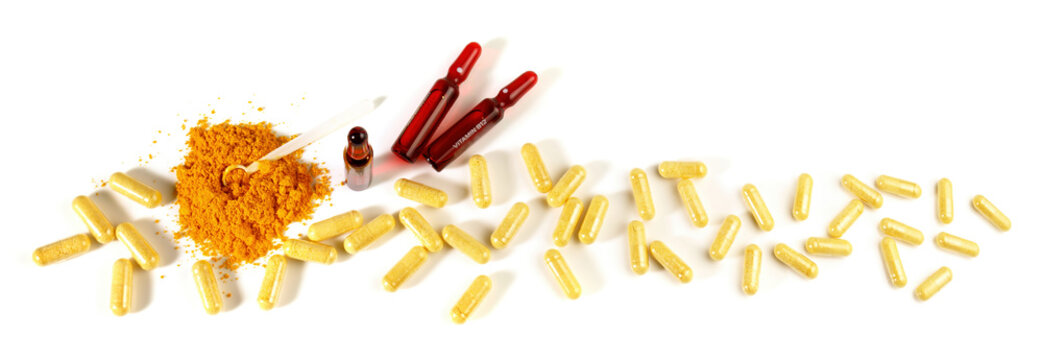 Food and Health - Vitamin B Capsules and Powder Panorama isolated on white Background
