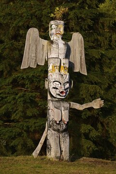 Kwakwakawakw totem pole at the cemetery in Alert Bay, Cormorant Island, British Columba, Canada