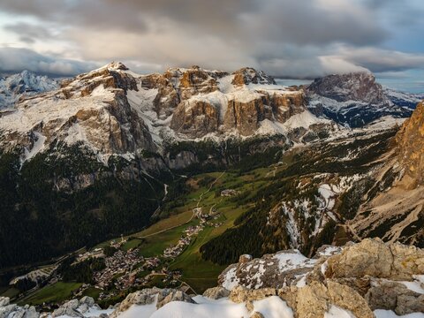 Sella group with fresh snow above the green Val Badia valley, Langkofel on the right, Dolomites, Trentino, South Tyrol, Italy