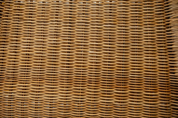 Obraz premium Close up of woven wicker texture with natural rattan pattern background showcasing traditional weaving craftsmanship.
