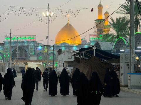 Karbala, Iraq - December 28, 2025: Golden dome and illuminated minarets of the Imam Hussain Shrine glowing at dusk in Karbala, Iraq	