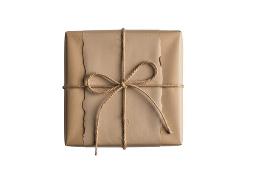 Square gift box wrapped in brown craft paper with a simple twine string bow tied on top center isolated on transparent background