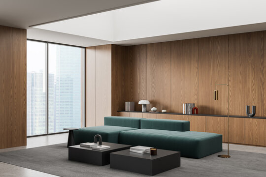 Modern interior lounge with teal modular sofa, wood‑panel walls, city‑view windows, sculptural decor and sleek furnishings arranged in spacious contemporary room. 3D Rendering