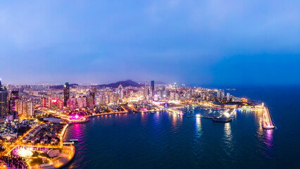 Fototapeta premium Night View of Coastal Urban Harbor and Modern Cityscape