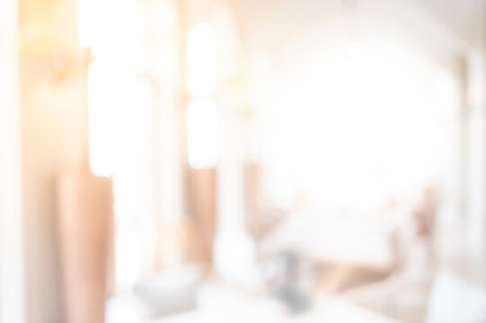 Abstract blurred restaurant interior background. Blur dinner table and decoration in dining hall of luxury hotel. Blurry backdrop for design element in eatery business and catering service concepts
