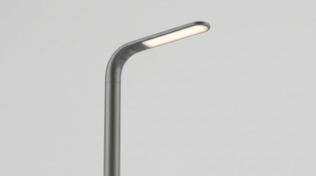 A sleek, modern, adjustable, gray floor lamp with a curved neck and a long, thin, illuminated light panel on a plain gray background.