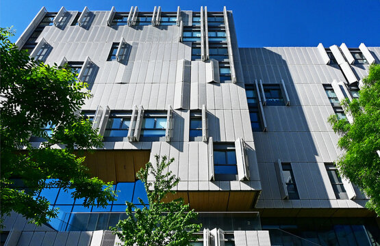 Geneva, Switzerland, Europe - 05.2026 : Grand Morillon Student House by famous Japanese architect Kengo Kuma, facades change each time when foldable metal mesh screens window shutters are in use