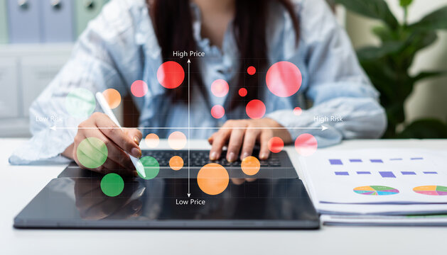 Business analyst evaluating investment portfolio using risk and return matrix dashboard on digital tablet, financial planning, market analysis, asset allocation, and strategic decision making.