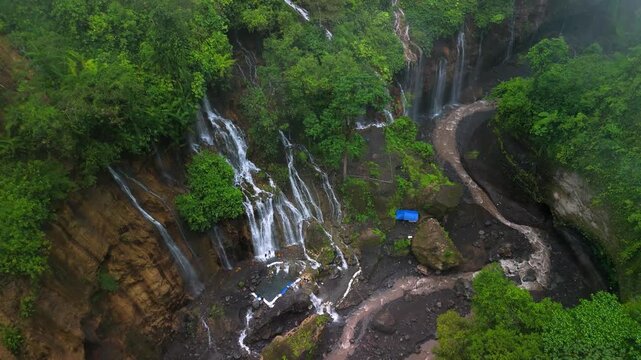Aerial Drone View of Surrounding Waterfalls in Tumpak Sewu Waterfall Canyon &ndash; Java Island Indonesia