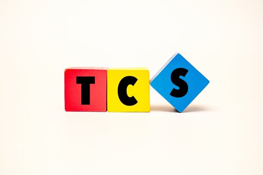 Colorful blocks with text TCS on it. TCS acronym for "TAX COLLECTED at SOURCE". Business finance, and accounting concepts