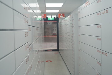 Rows of smart lockers in automated parcel pickup store © YiChuan