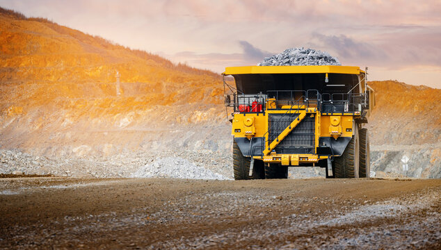 Banner open pit mine industry, big yellow mining truck for gold ore.
