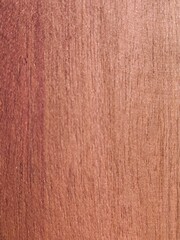 Fototapeta premium Seamless close up texture of pink mahogany or rosewood with fine vertical grain