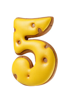 Gingerbread cookie shaped as a number five with bright yellow icing isolated. Transparent PNG image.