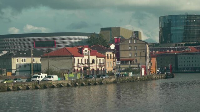 Bilbao cityscape with old houses and modern buildings on the nervi&oacute;n river