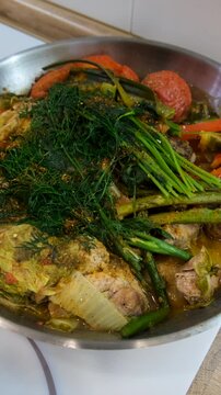 A dish of stewed vegetables in a frying pan. Selective focus.