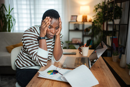 Stressed adult man managing financial problems and worrying about debt