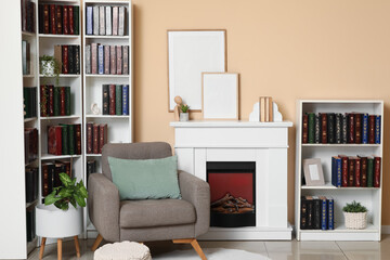 Obraz premium Cozy home interior with fireplace, armchair, and bookshelves, modern living room decor and reading nook