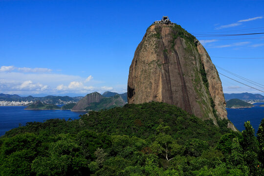 Brazil, Rio de Janeiro, Sugar Loaf Mountain - Pao de Acucar and cable car station. The bay and Atlantic Ocean in the background.