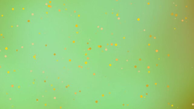 Abstract and bright background with floating colorful particles in a light green gradient