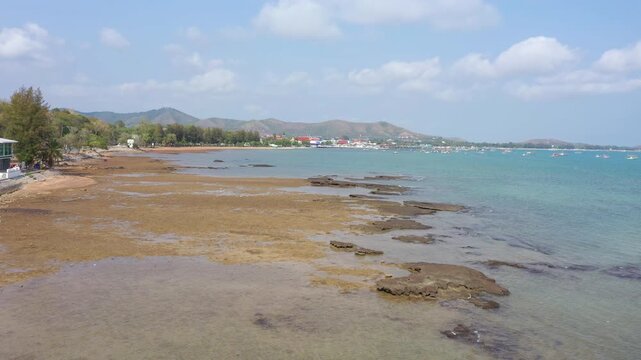 Aerial footage of Sattahip district located in Chomburi province.