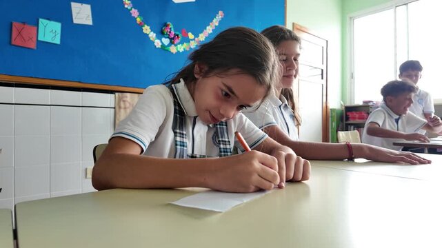 Schoolgirl Writing a Message During Class