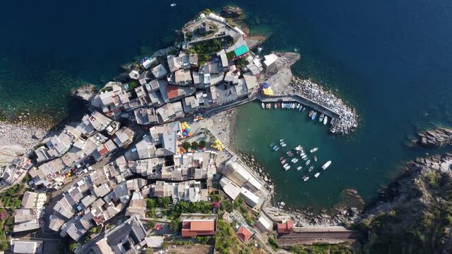 Aerial view of Vernazza, the most picturesque village in the Cinque Terre, consisting of colorful houses on the cliffs overlooking the sea on the eastern Ligurian Riviera. Liguria. Italy