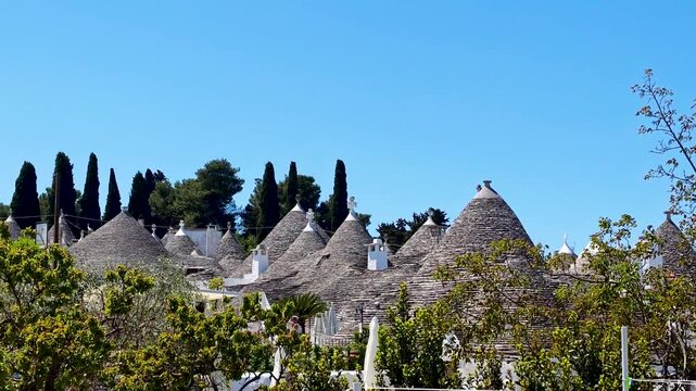 4K video footage of Alberobello city with traditional white trulli houses, charming Puglia village architecture and UNESCO heritage atmosphere in Italy