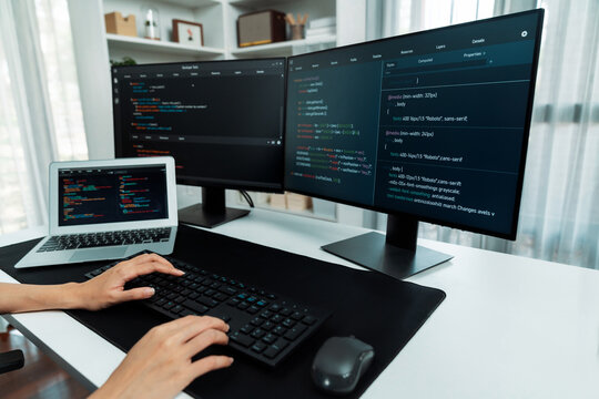 Cropped hands image of IT developer creating with typing information on pc with coding program information data website application, wearing jeans shirt surround safety analysis two screen. Stratagem.