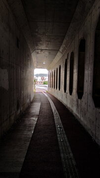 View to the daily light City in the end of Dark Overpass Tunnel