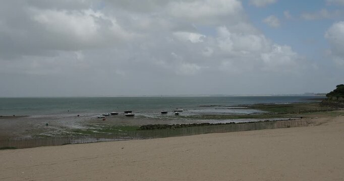 Saint Martin de R&eacute;, a fortified town on the &Icirc;le de R&eacute;. La Cible beach facing the Pointe de la Berg&egrave;re on Atlantic Ocean with a view of the viaduct on horizon between La Rochelle and the island 
