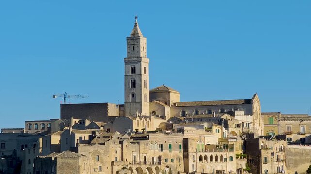 Matera. 4K panoramic video footage of Sassi di Matera in Italy, historic Sassi cave dwellings and ancient stone architecture in scenic Basilicata landscape