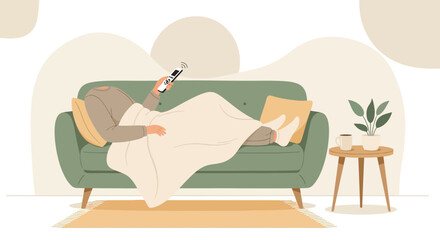 Obraz premium Woman Relaxing on Sofa Under Blanket with Remote Control, Cozy Home Atmosphere