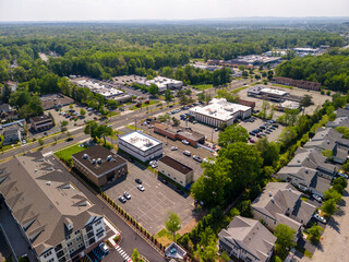 Obraz premium Aerial view of suburban landscape with business district