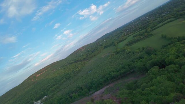 Summer aerial view featuring Chauncey Peak at Doctor Francis Giuffrida Park and the Bradley Hubbard Reservoir in Meriden, Connecticut just before sunset