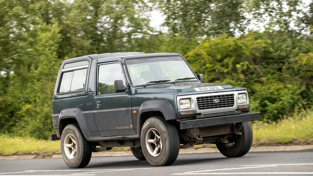 Stony Stratford,Bucks,UK - June 7th 2026: 1998 green Daihatsu Fourtak SUV car driving on a British road