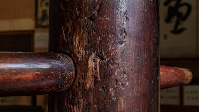 kungfu. Close-up of a worn wooden Wing Chun dummy with impact marks and patina. bar promotions, beverage menus, designed for food & beverage menus and cafe branding.