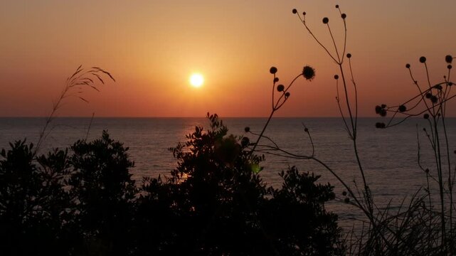 Beautiful Red Sunset on the Sea. Summer Tropical Sunset Sea View. Beautiful Seascape, Red Dusk on the Ocean.