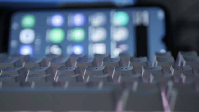 Blurred Shooting with a Person Working Night, Typing on Keyboard, Using Internet Connection. Computer Programmer Accesing Social Media Network.